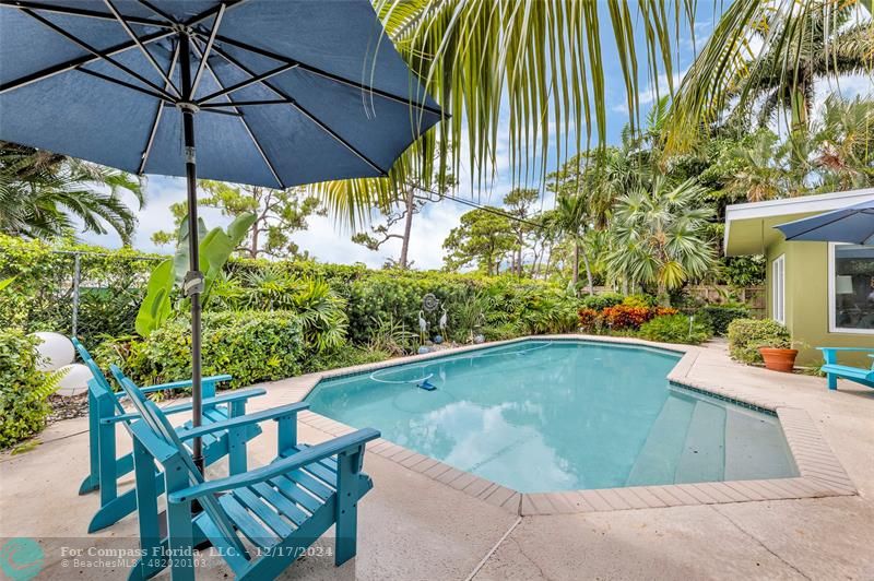 a view of a swimming pool with a patio