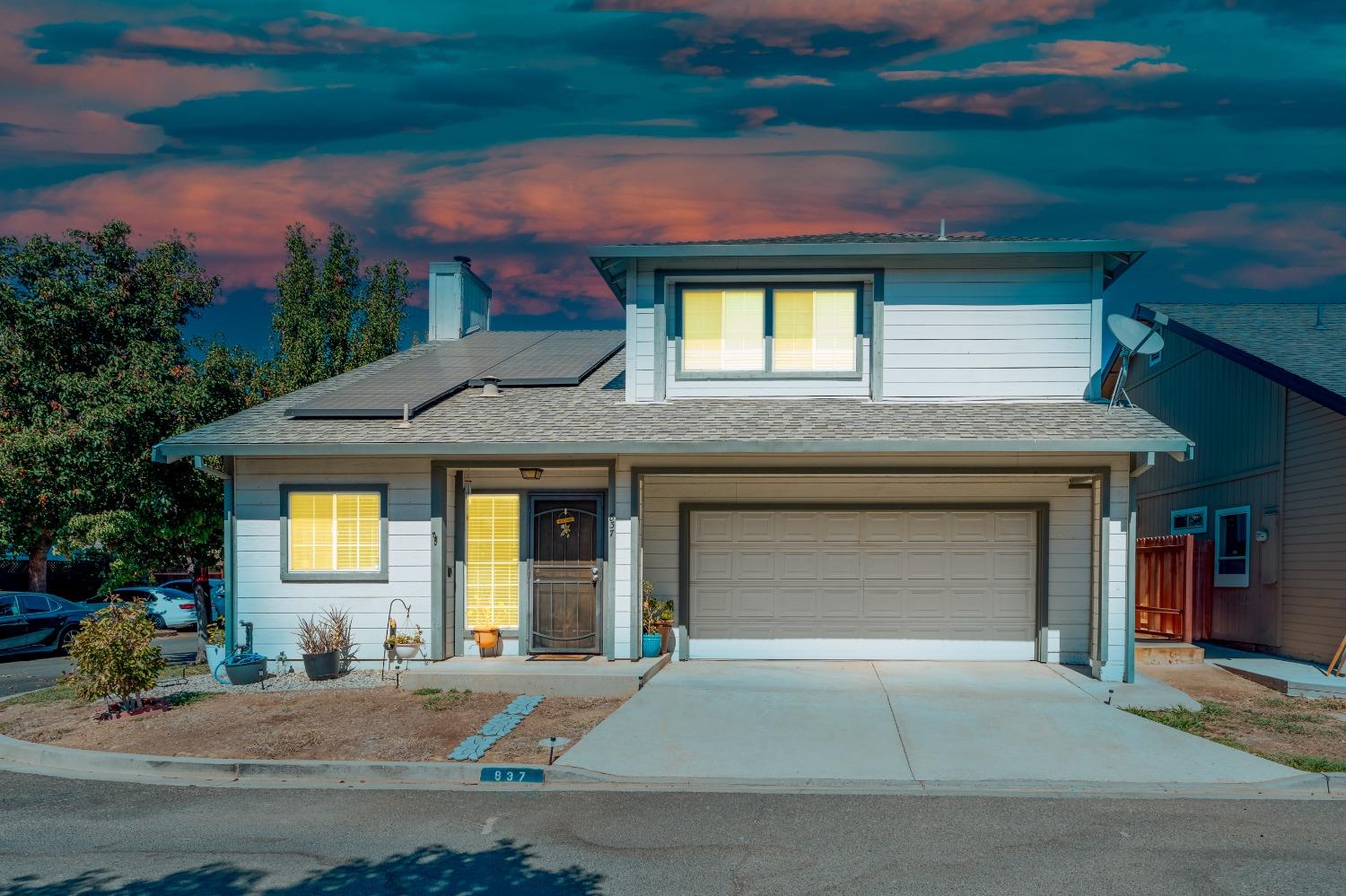 a front view of a house with a yard