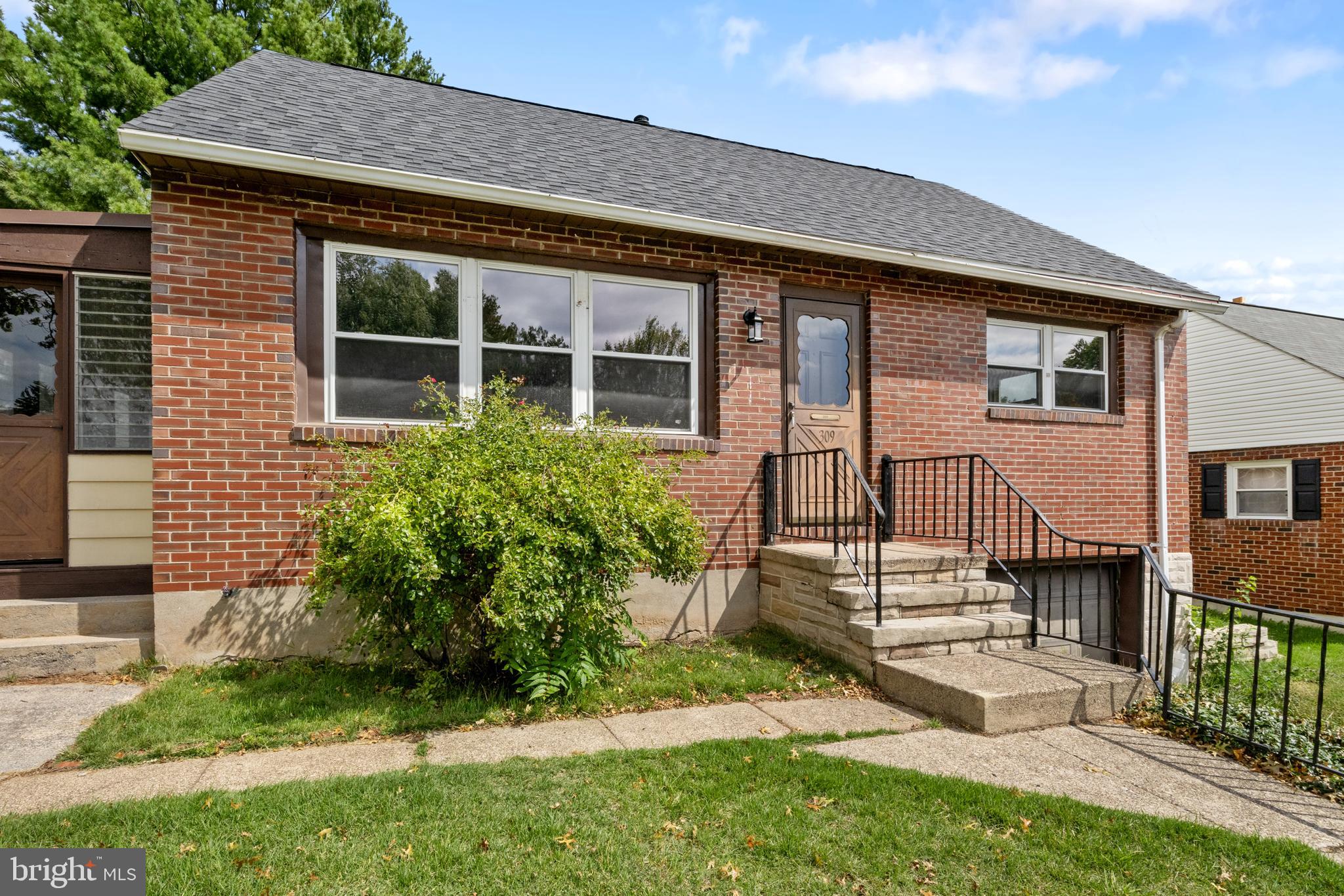 front view of a house with a yard