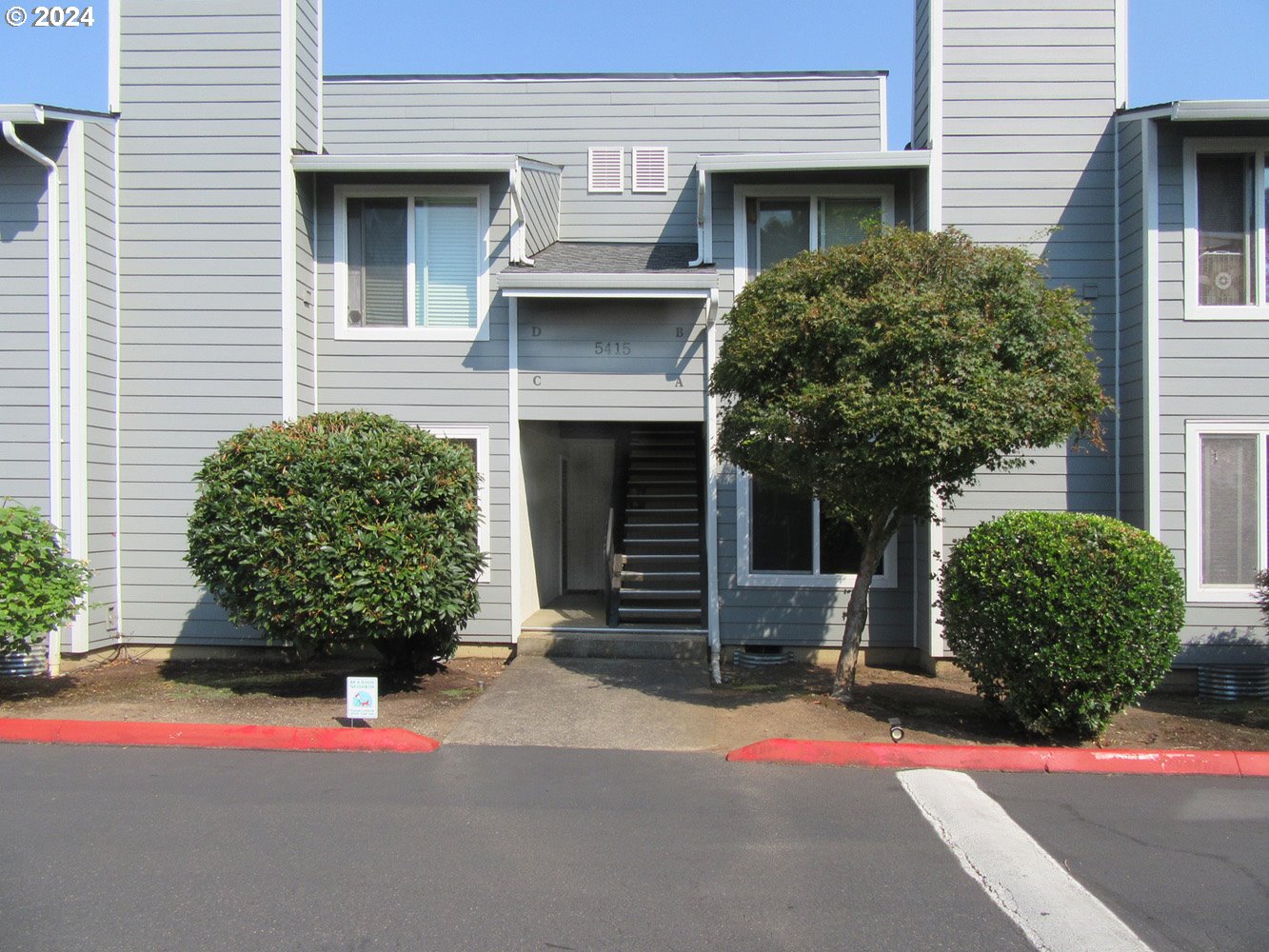 a front view of a house with a garage