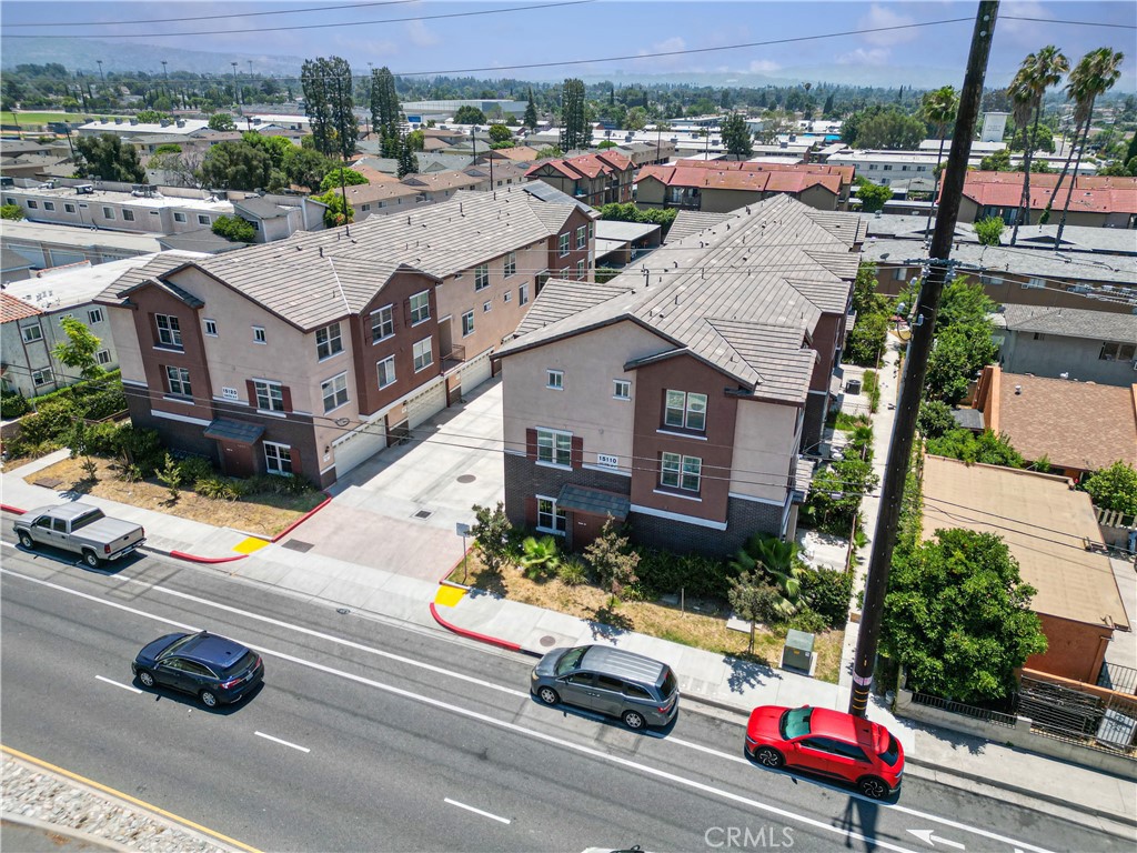 an aerial view of a houses with yard