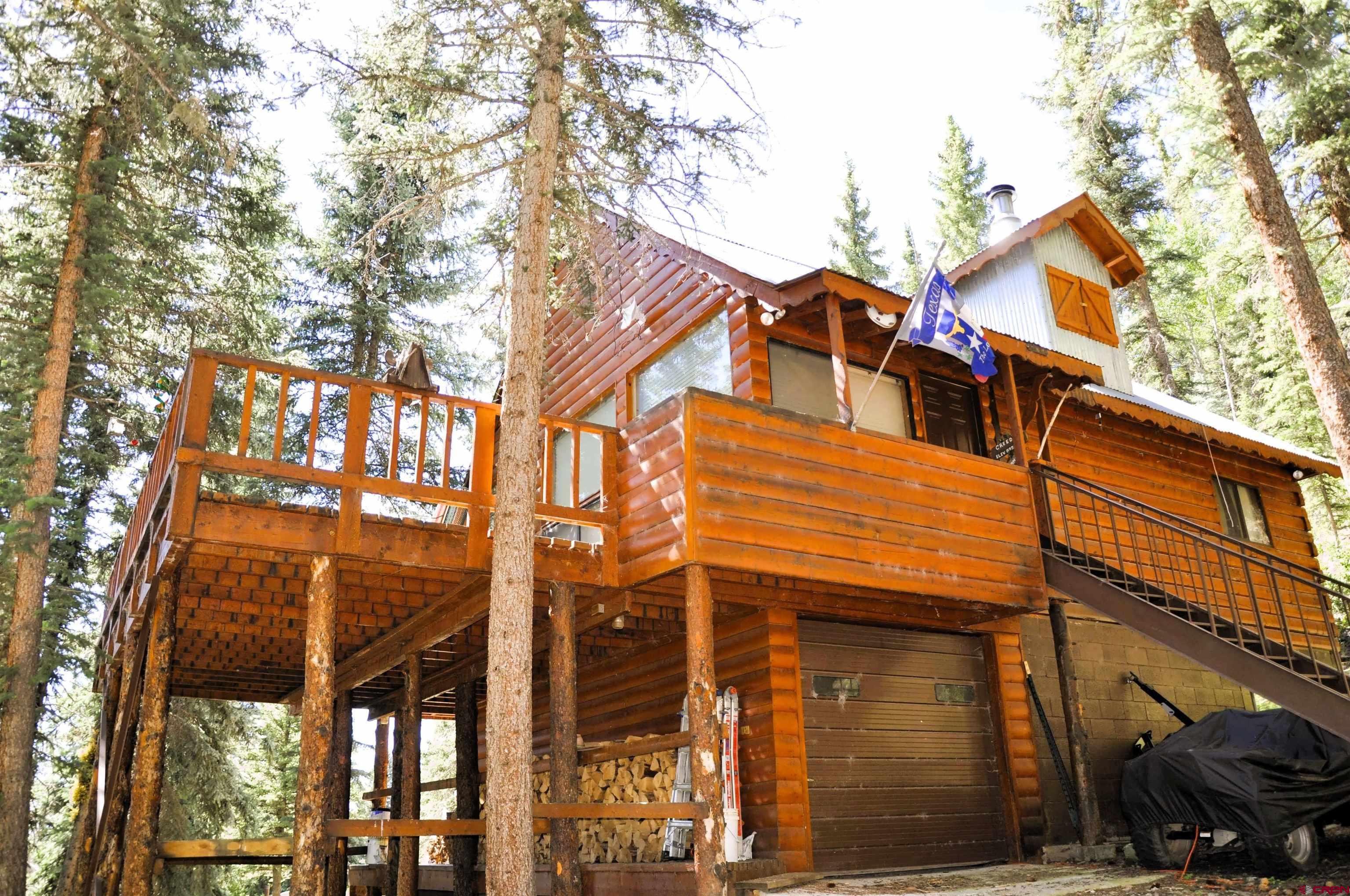 a view of a house with a tree