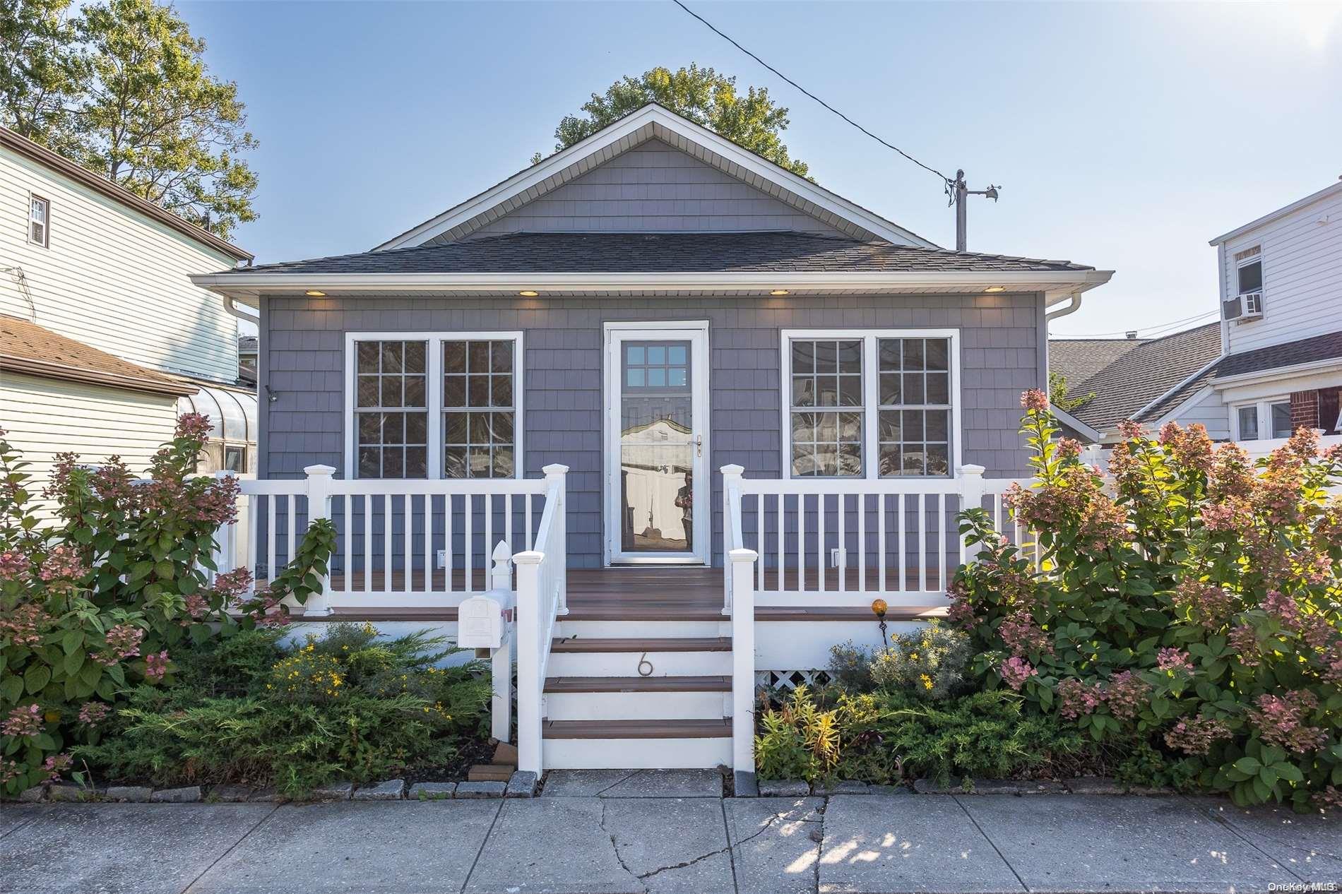 a front view of a house with a porch