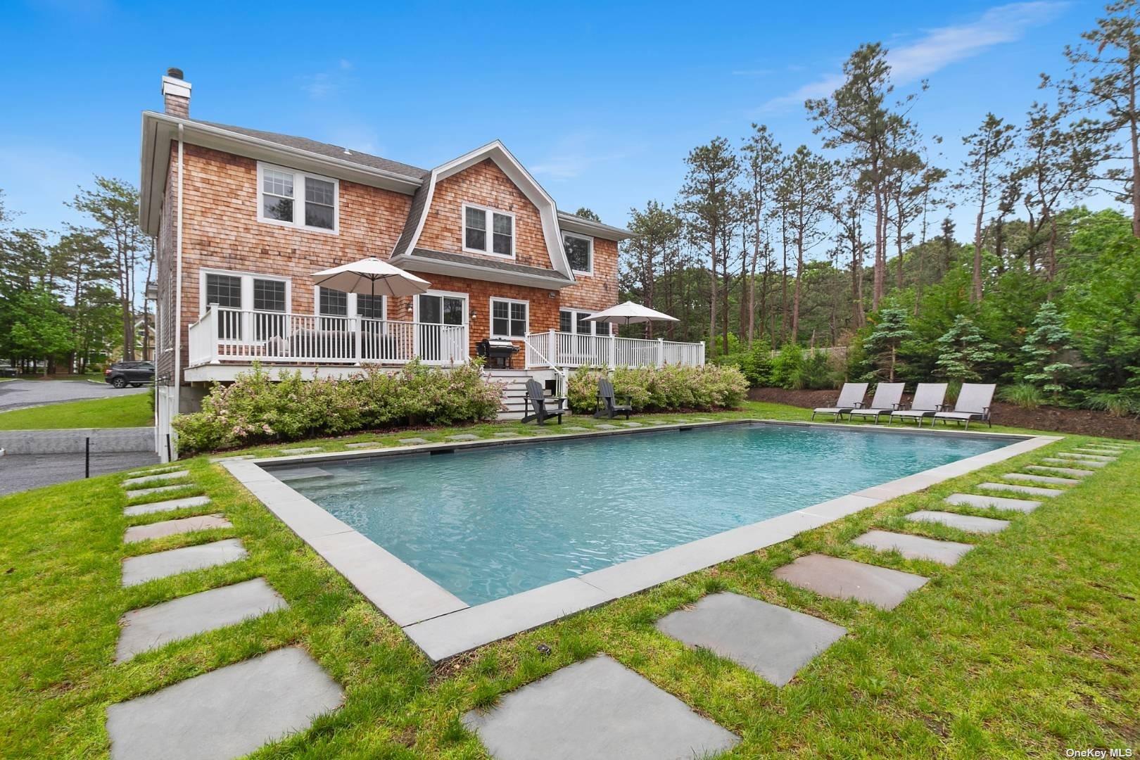 a view of a house with swimming pool