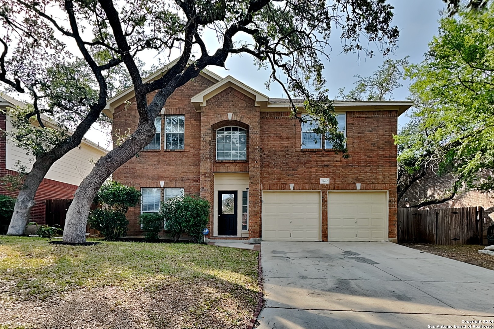 a front view of a house with a yard