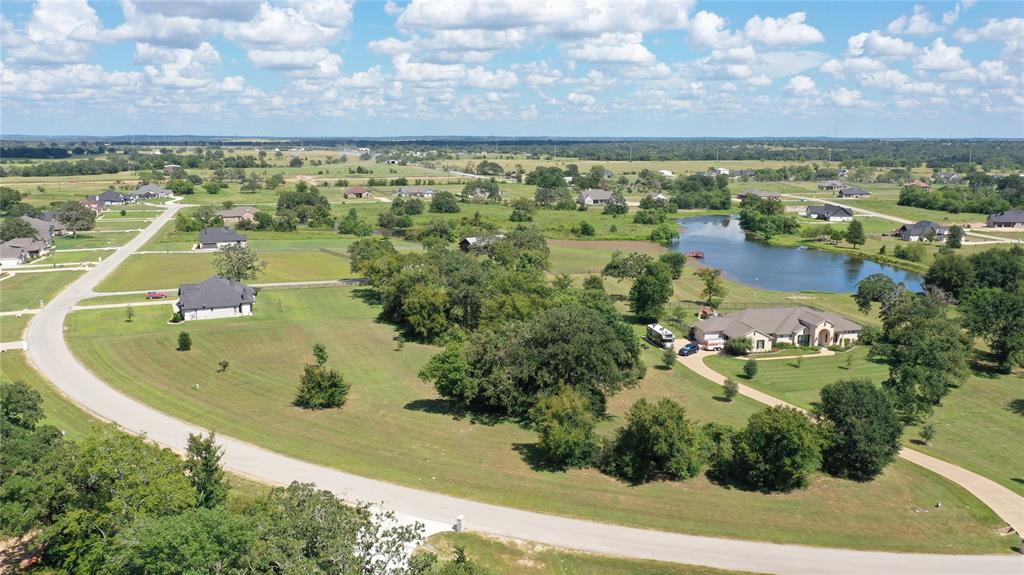 an aerial view of residential house and lake view