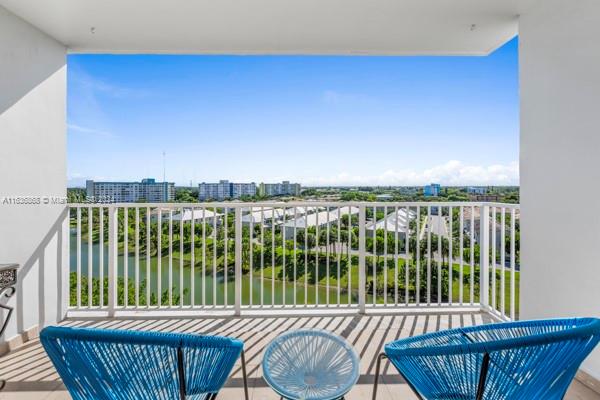 a balcony with a table and chairs