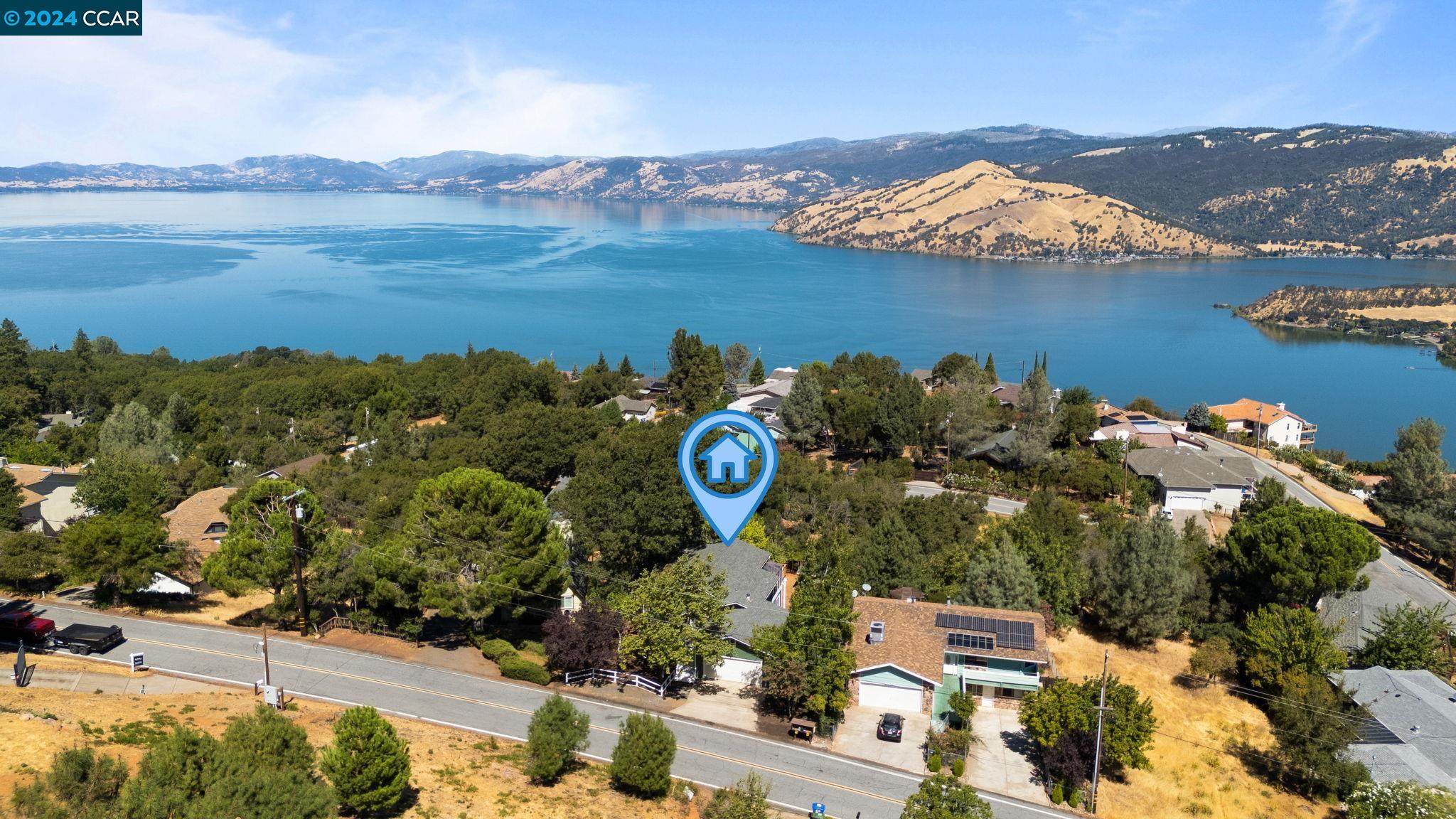 a aerial view of a house with a lake view