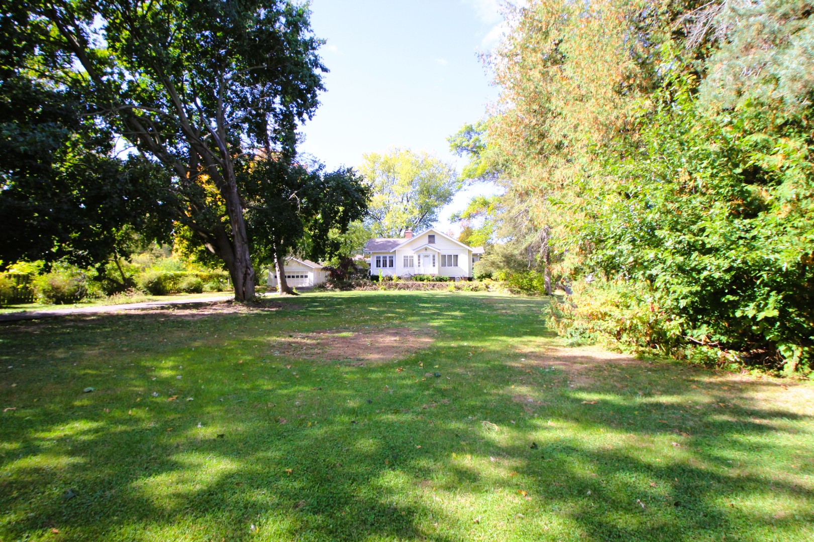 a view of a golf course with a trees