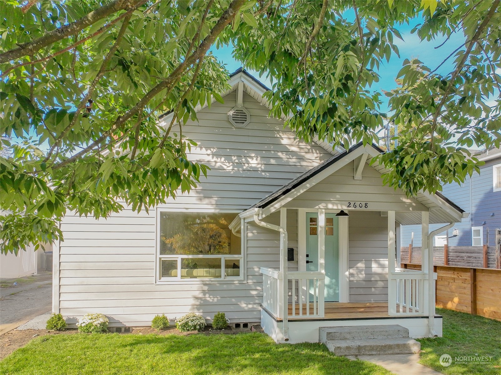 front view of a house with a yard