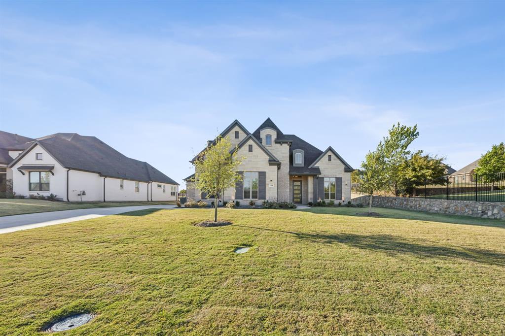 a view of a house with a swimming pool and a yard