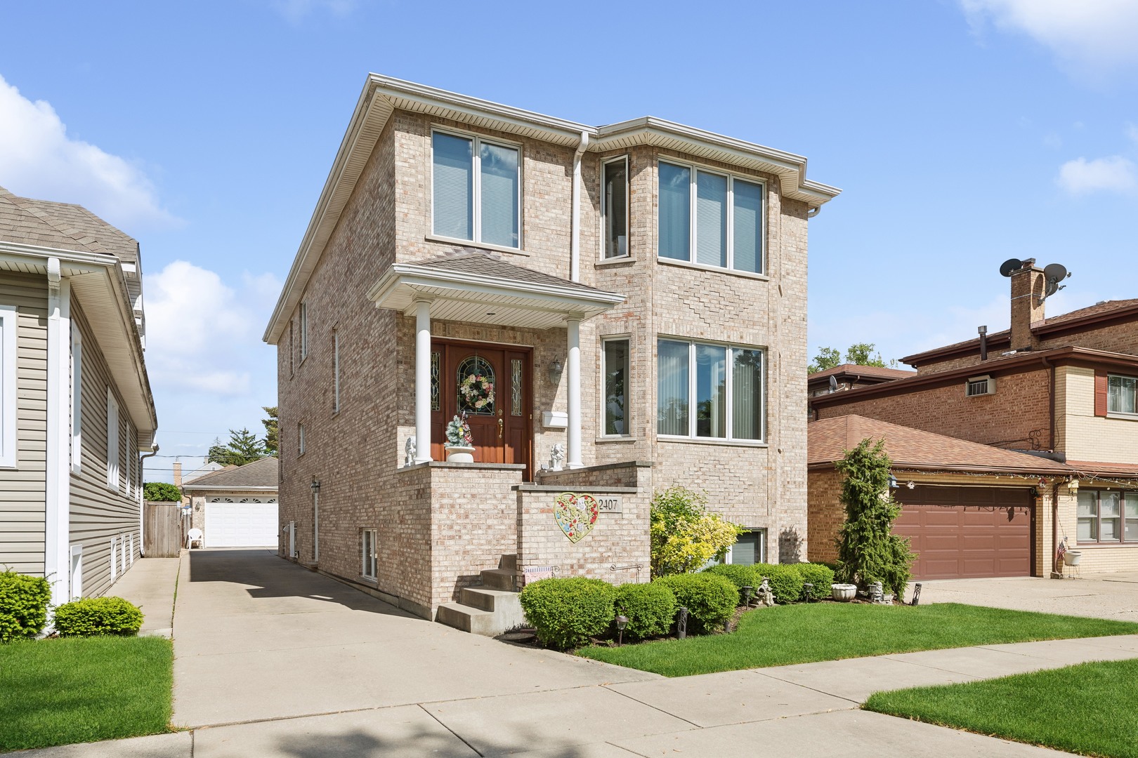 a front view of a house with garden