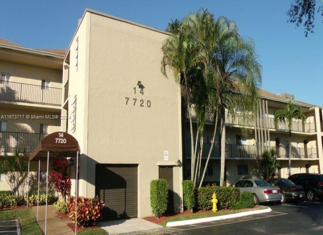 a front view of a building with street view