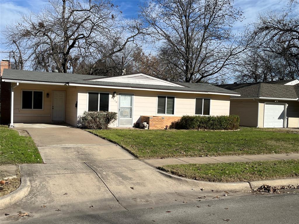 front view of a house and a yard