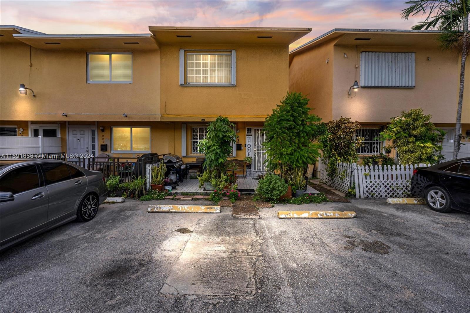 a view of a car park in front of a house