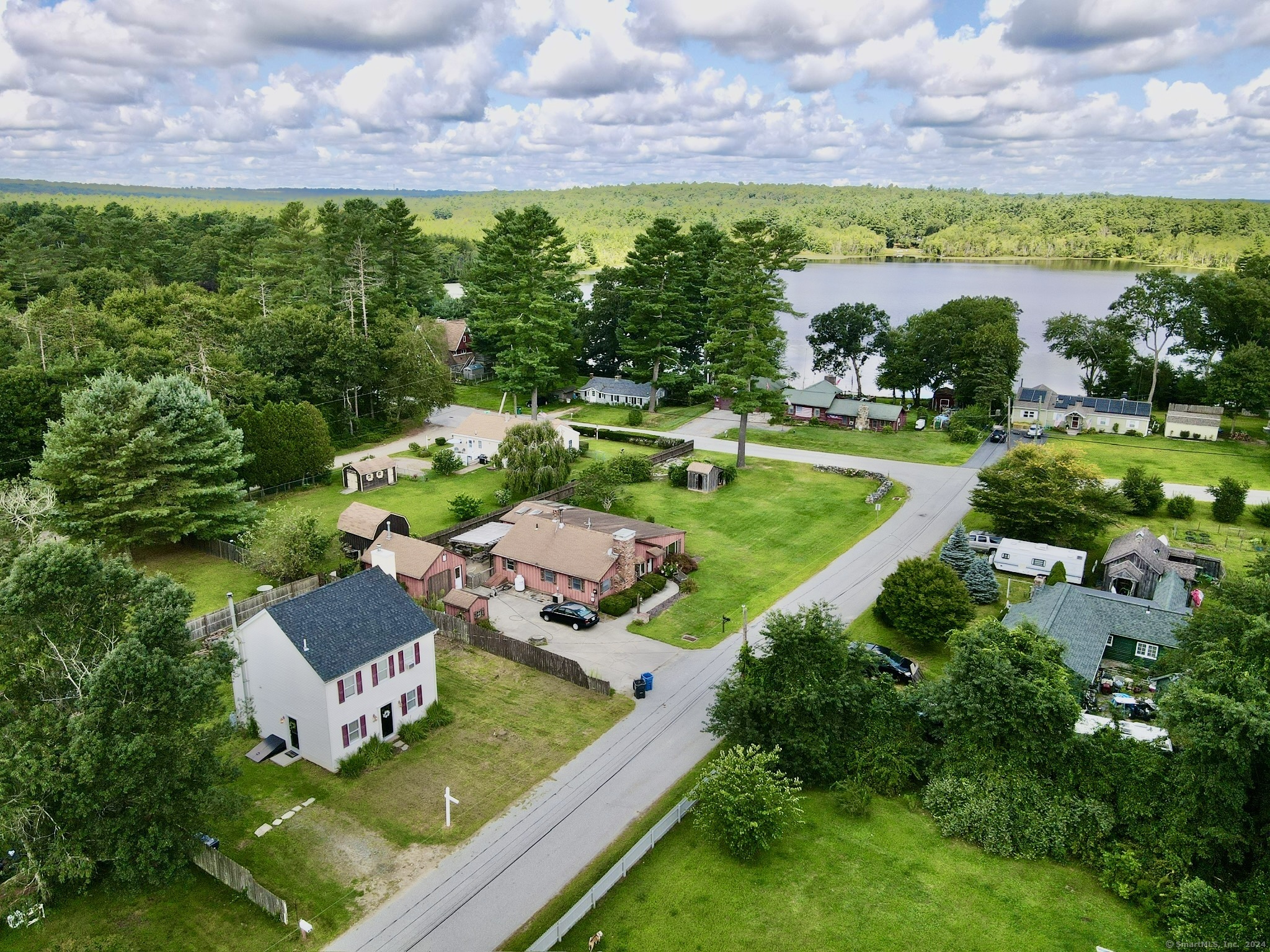 a view of a house with a yard and a garden