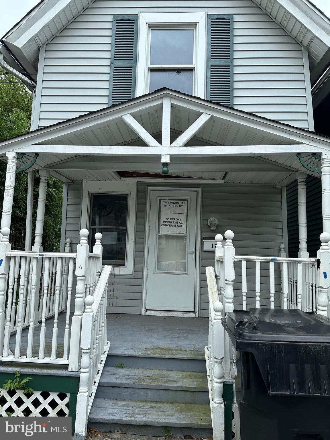 a front view of house with deck