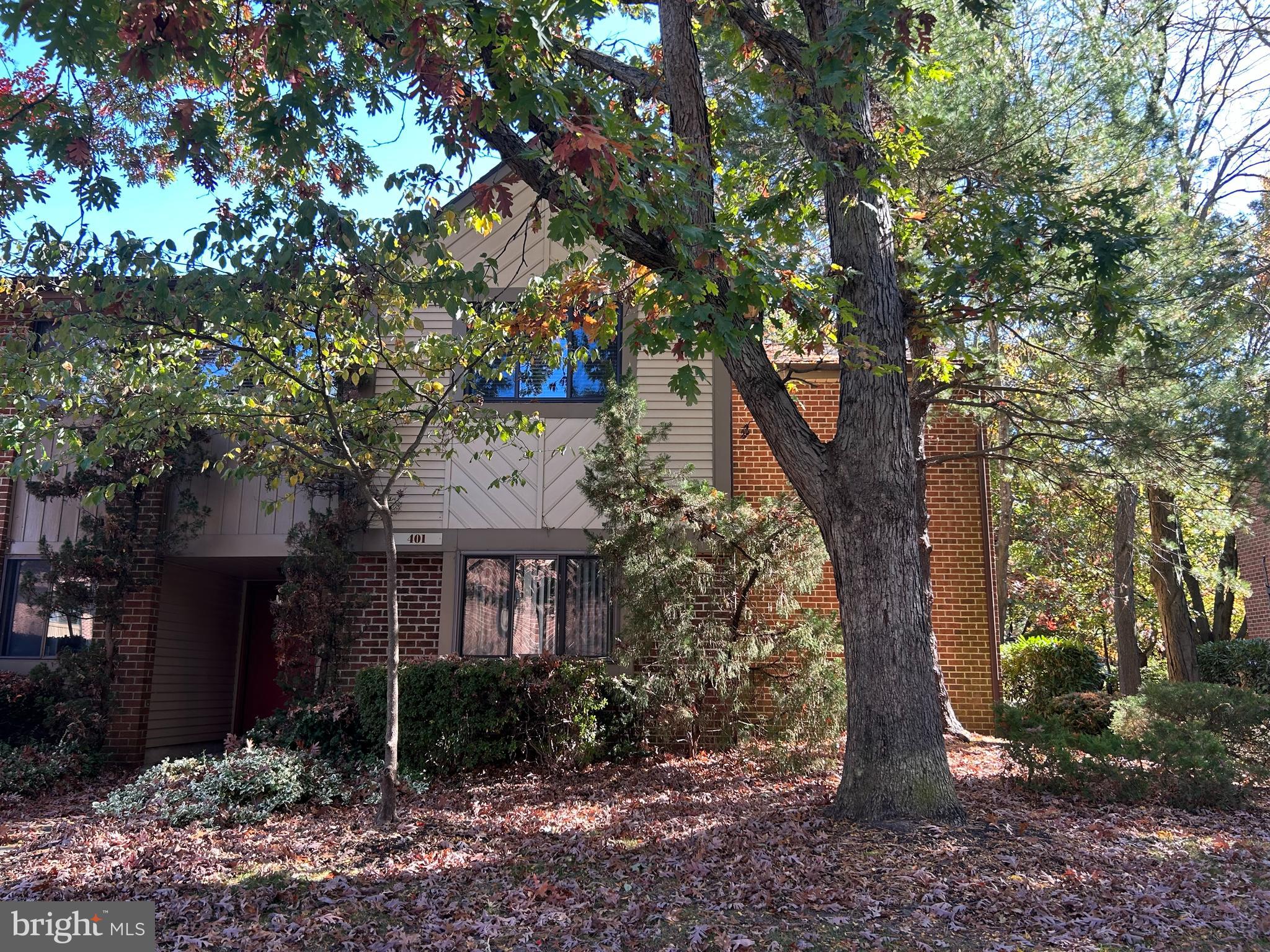 a view of a house with a tree and a tree