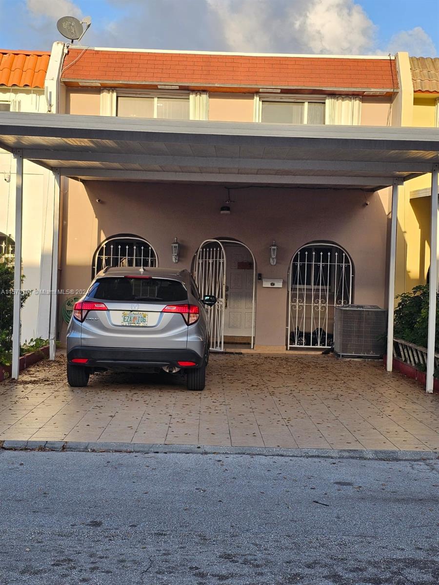 a car parked in front of a house