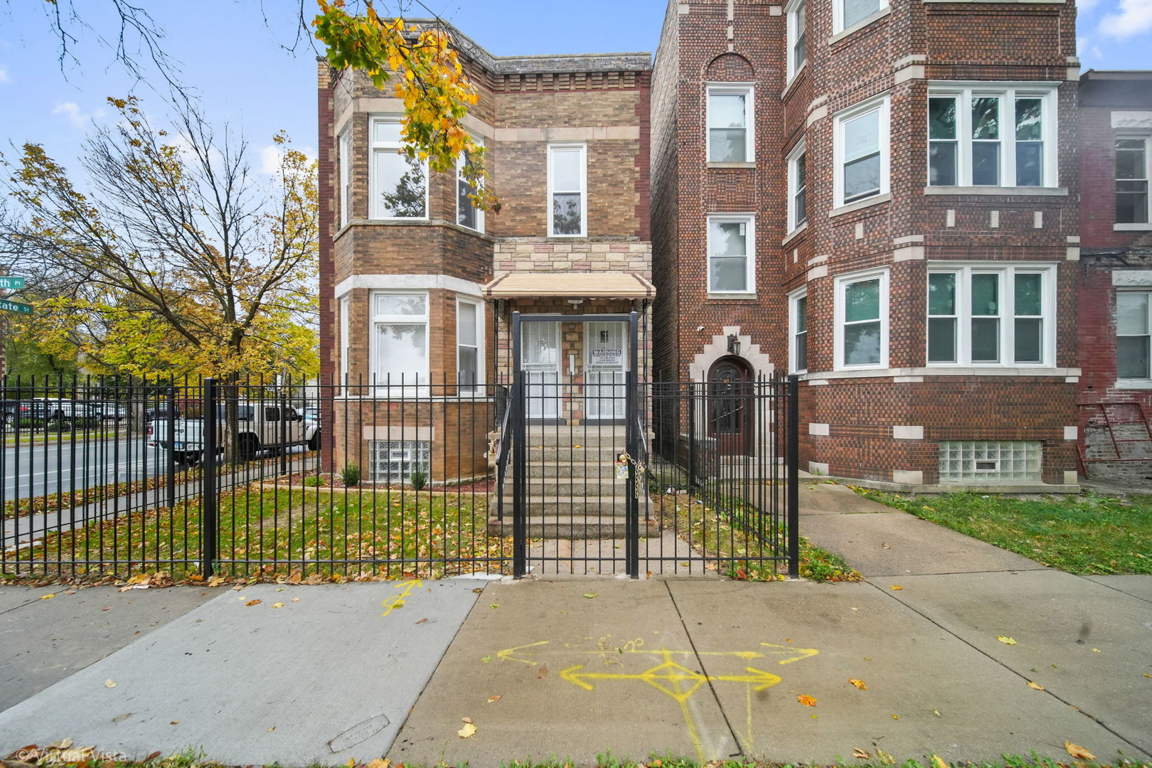 a view of a brick building and a street