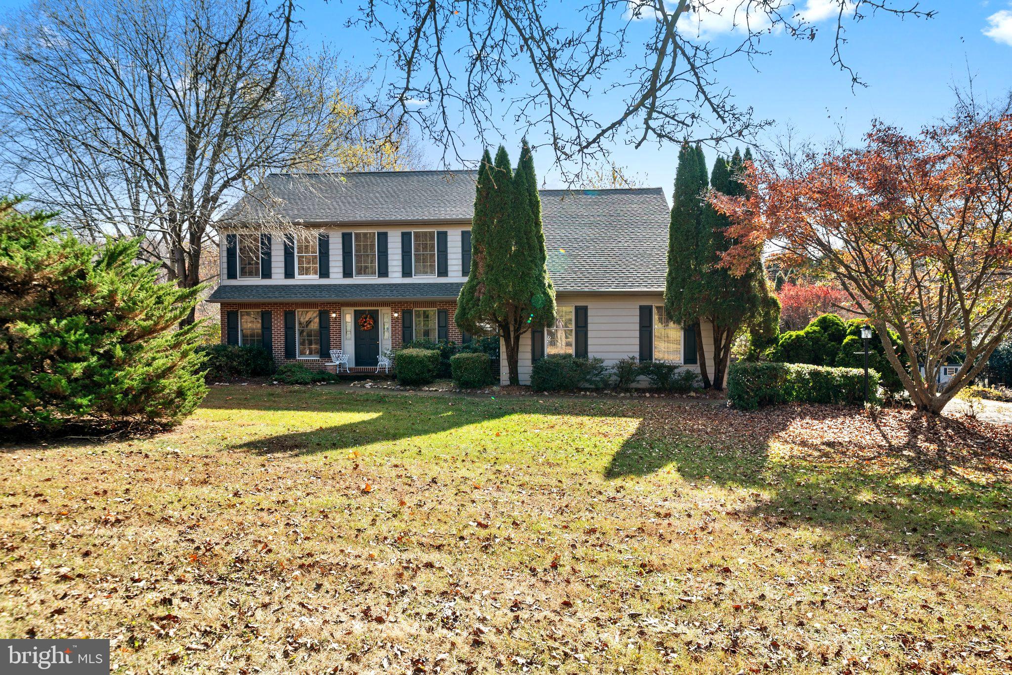 a view of a brick house with a yard