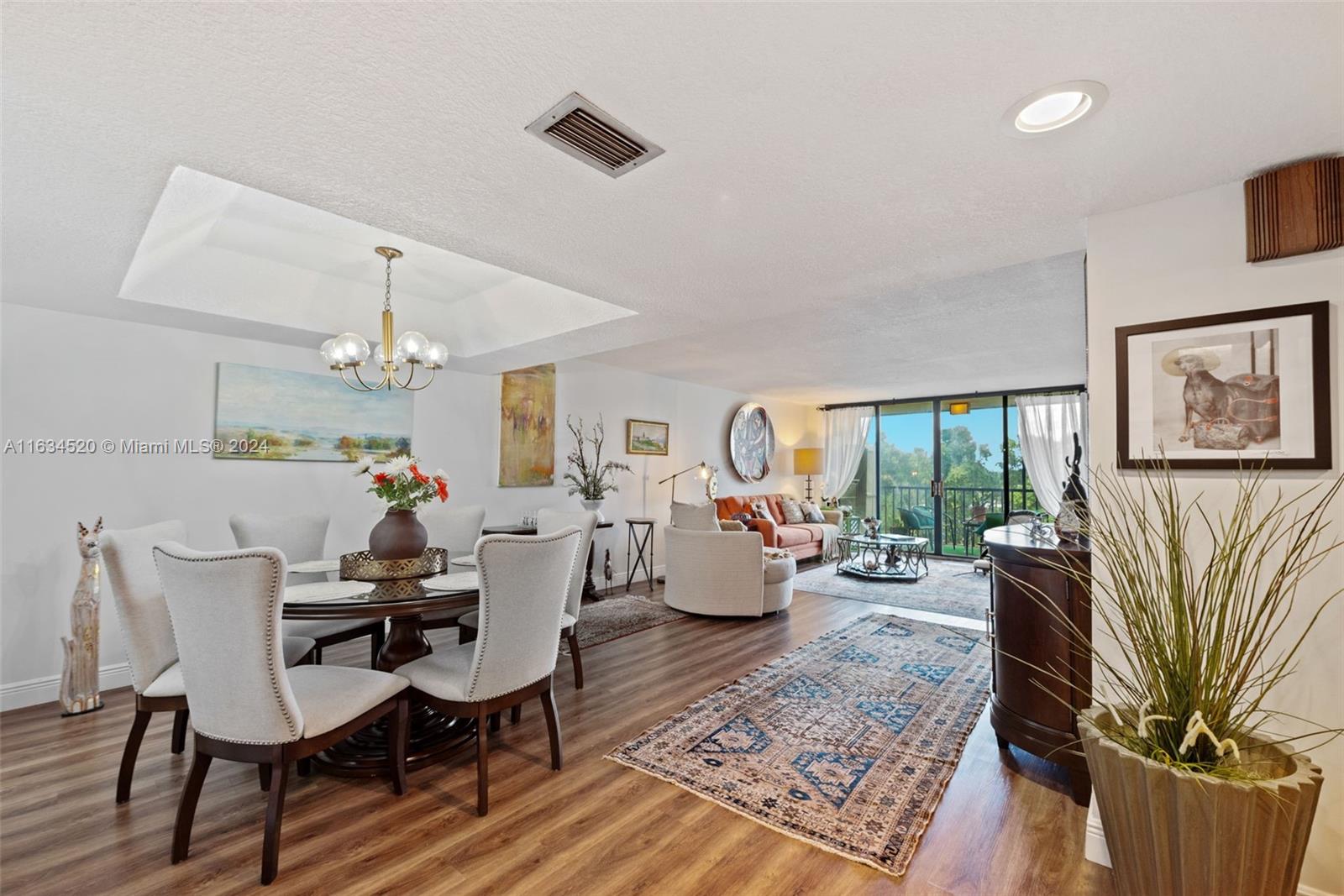 a living room with fireplace furniture and a wooden floor