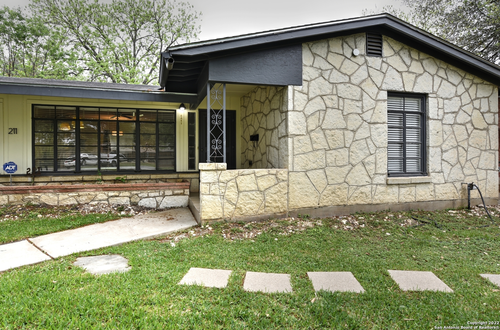 front view of a house with a yard