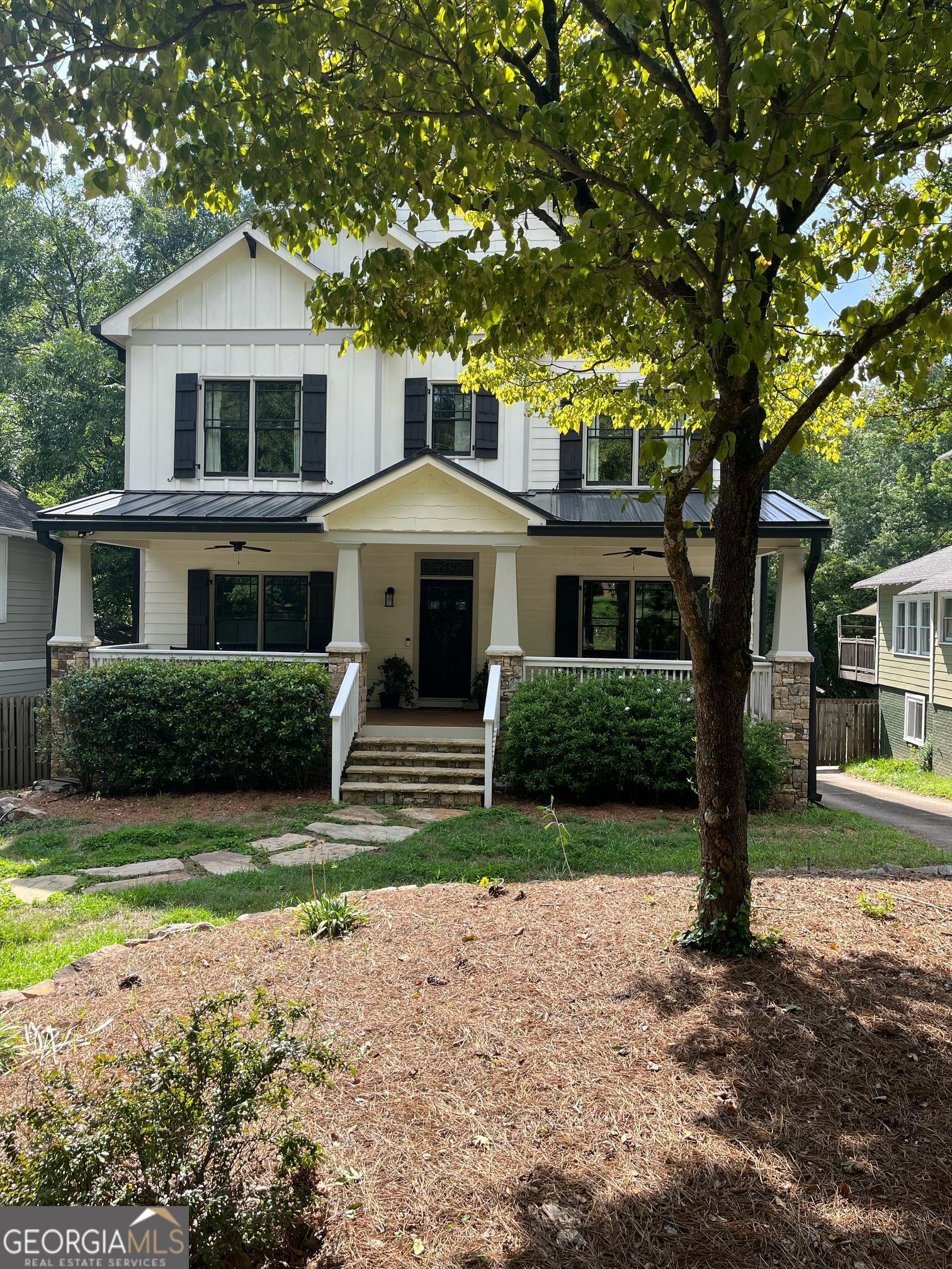 a front view of a house with garden