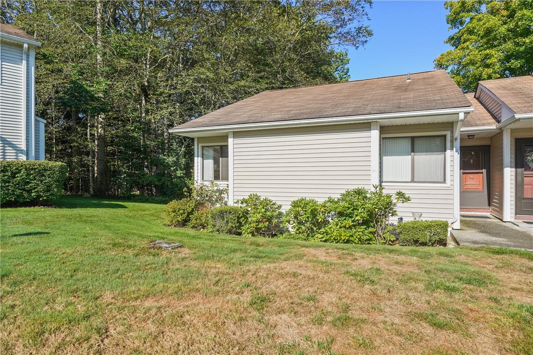 View of home's exterior featuring a yard