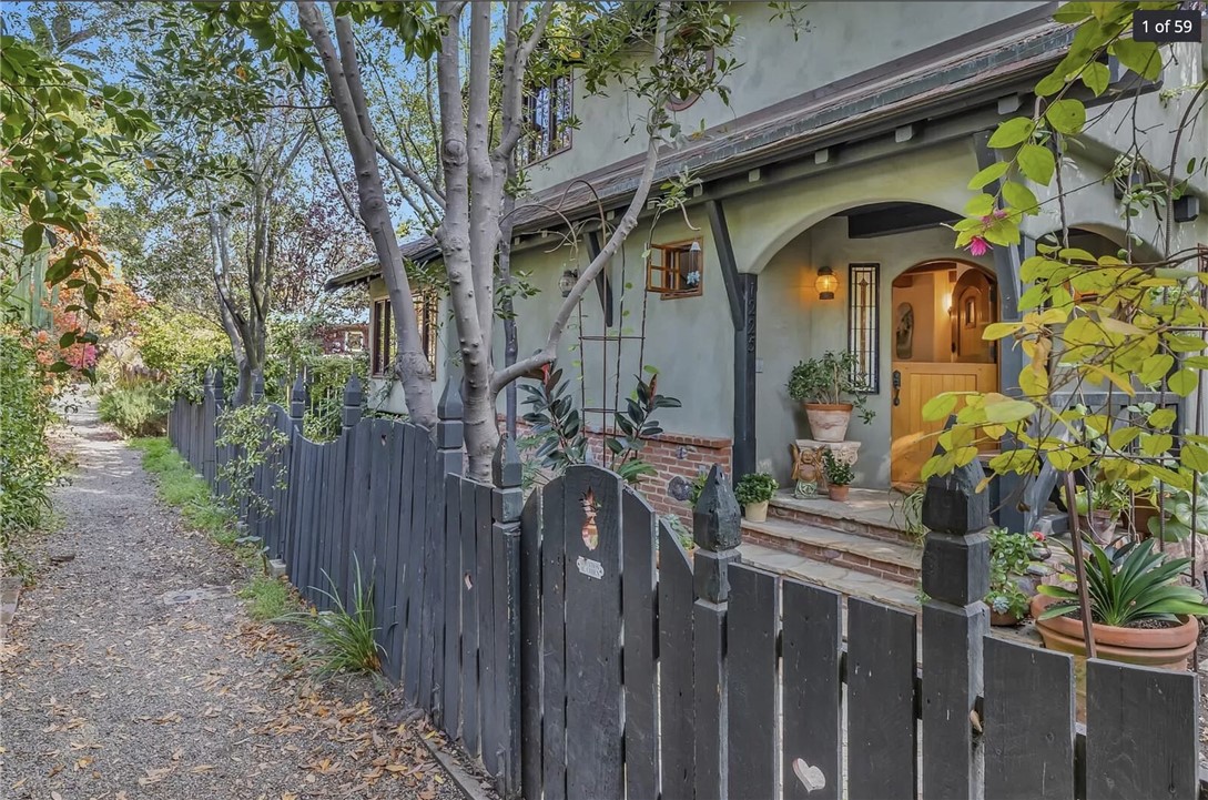 a view of a wooden house with a bench