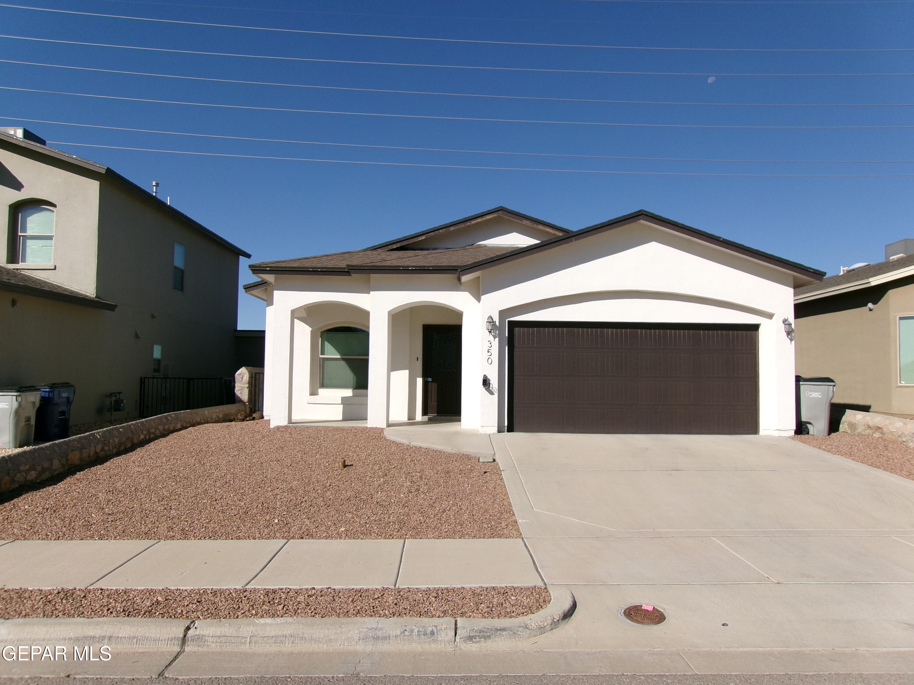 a front view of a house with yard