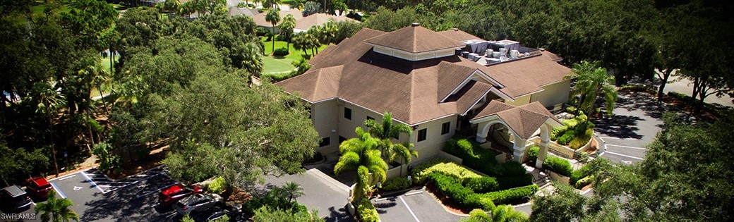 an aerial view of a house with a yard and garden