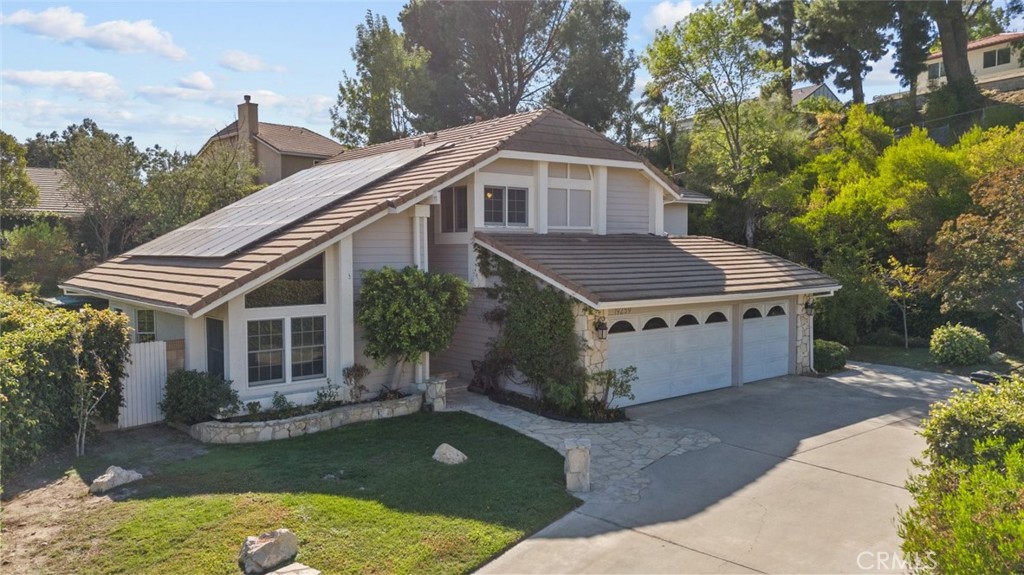 a aerial view of a house with a yard