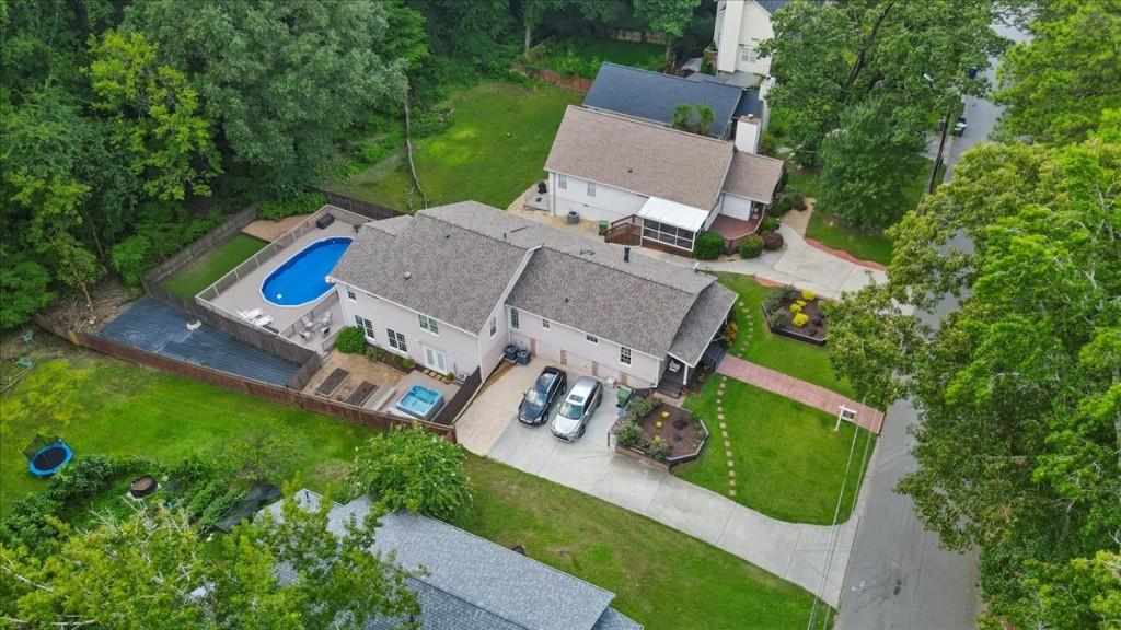 an aerial view of a house with outdoor space