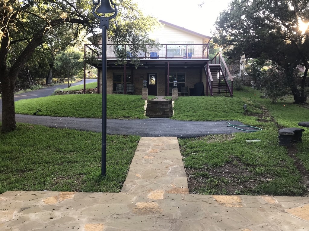 a front view of a house with garden