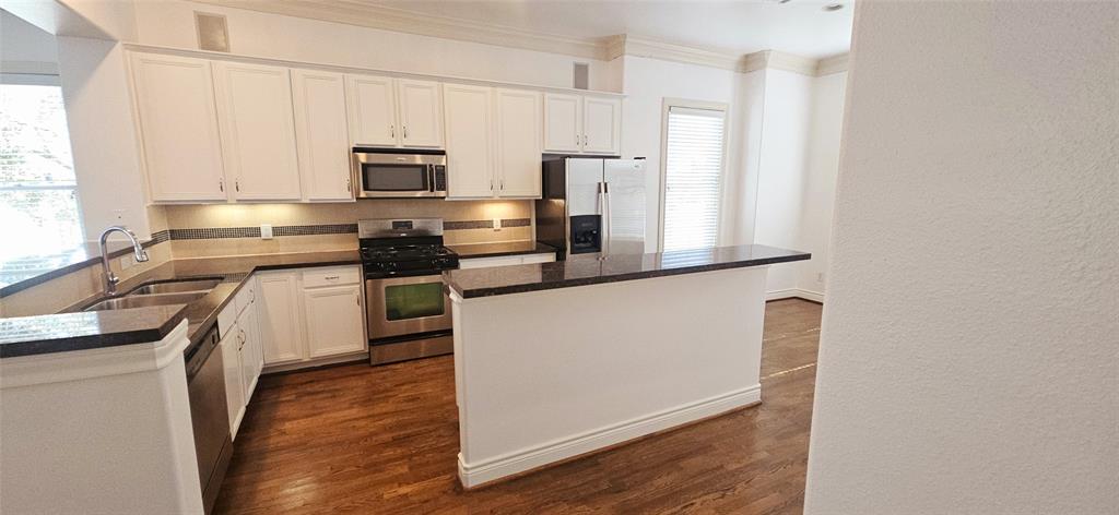 Kitchen cabinets just painted white and updated hardware installed!