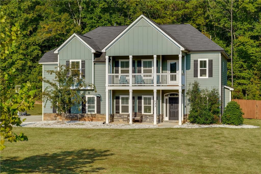 a front view of a house with a yard