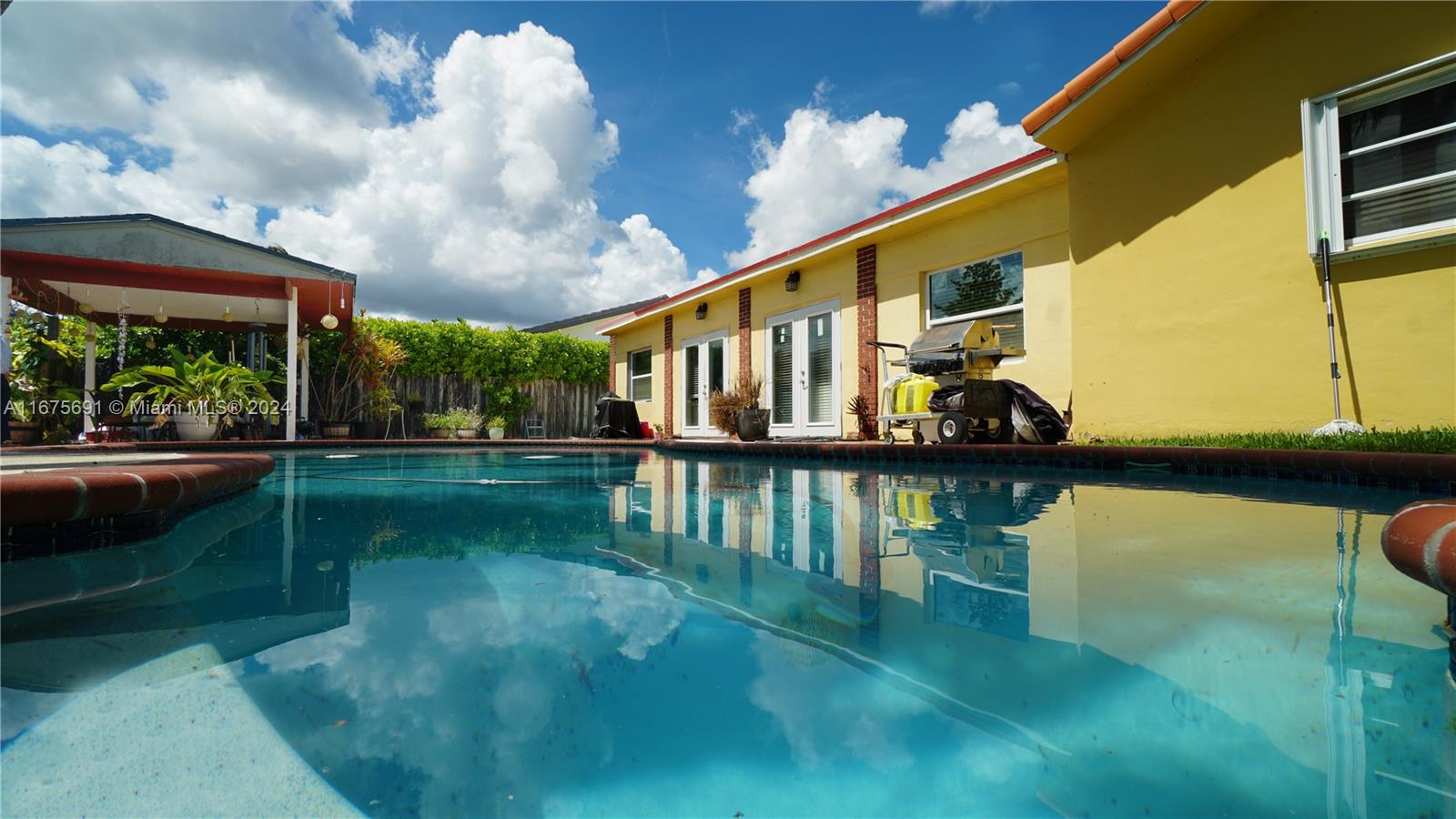 a view of swimming pool from a balcony