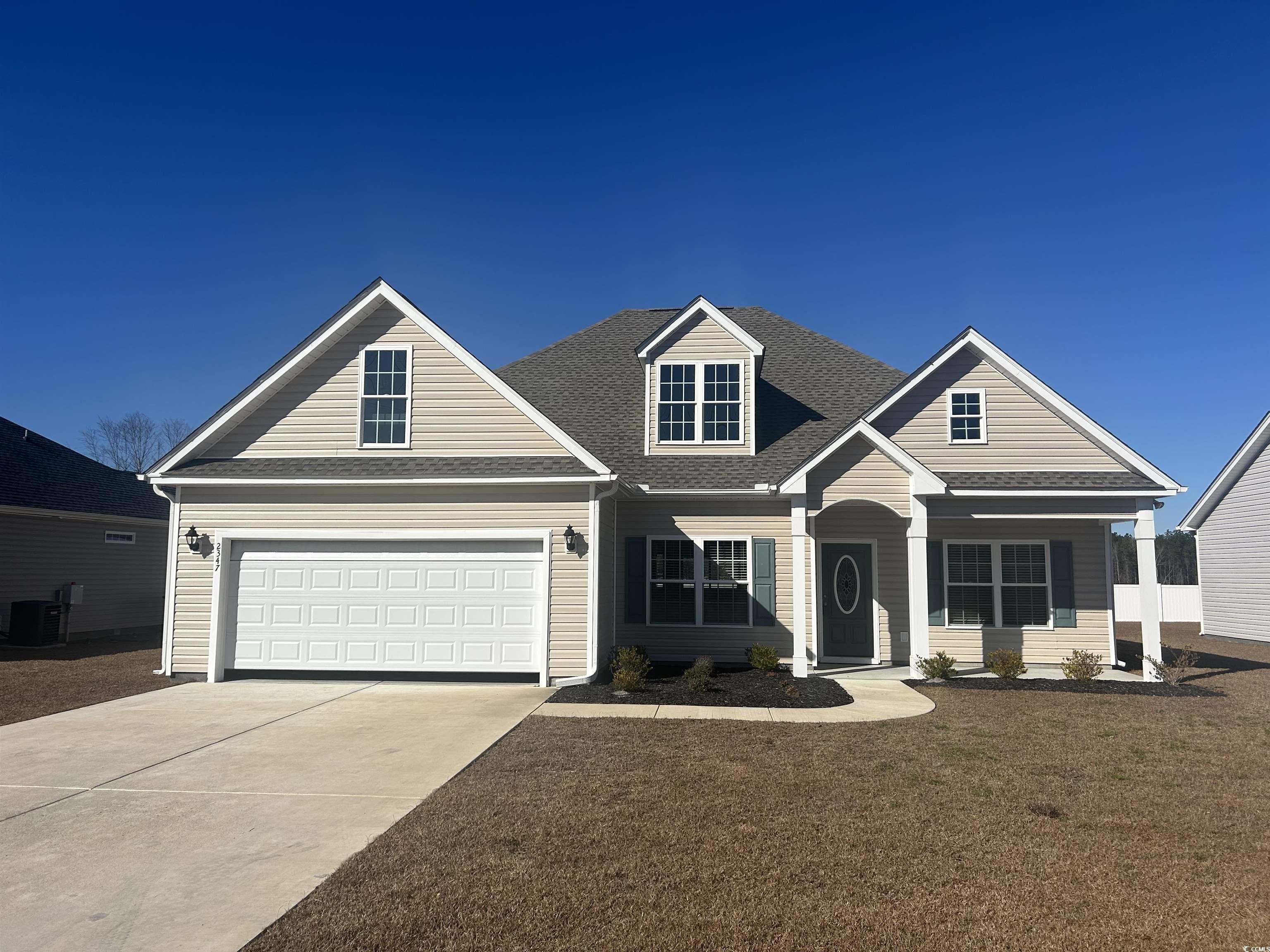 View of front of house featuring a front lawn and