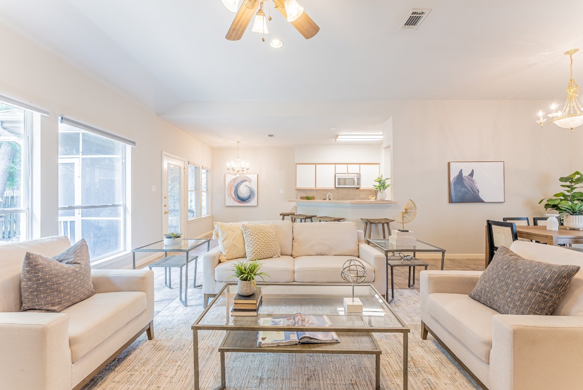 a living room with furniture and a large window