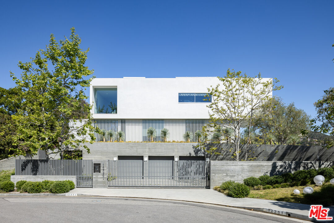 a view of a building with a yard