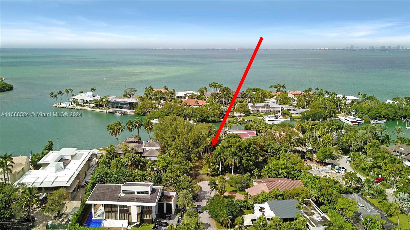 an aerial view of a house with a lake view