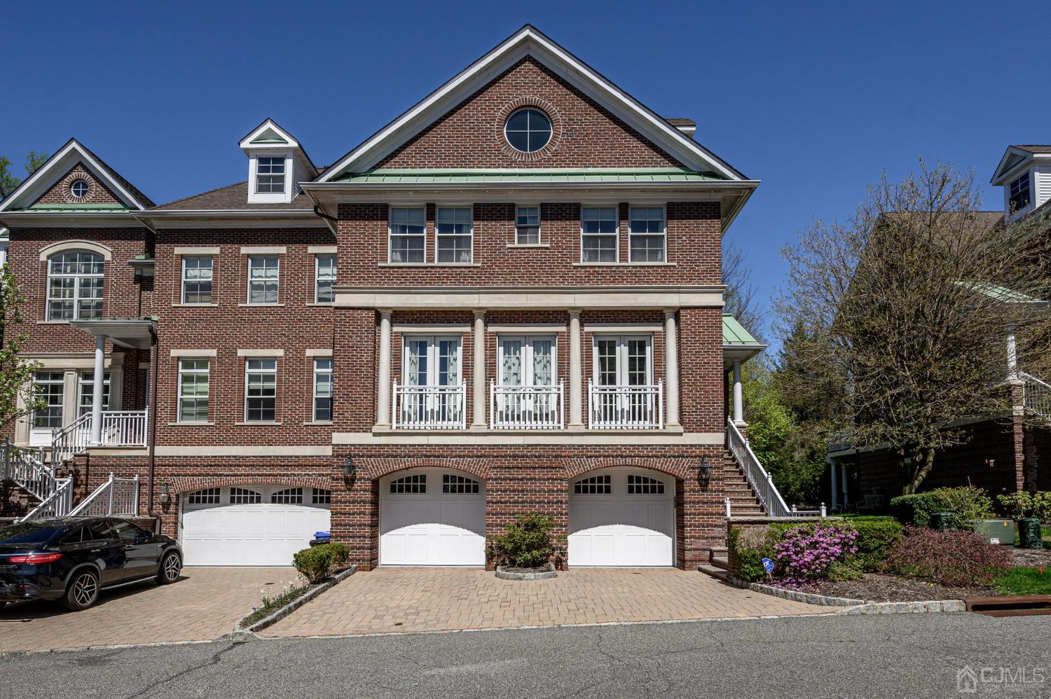 a front view of a house with parking