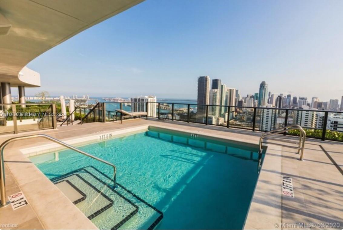 a view of a swimming pool with a lounge chairs