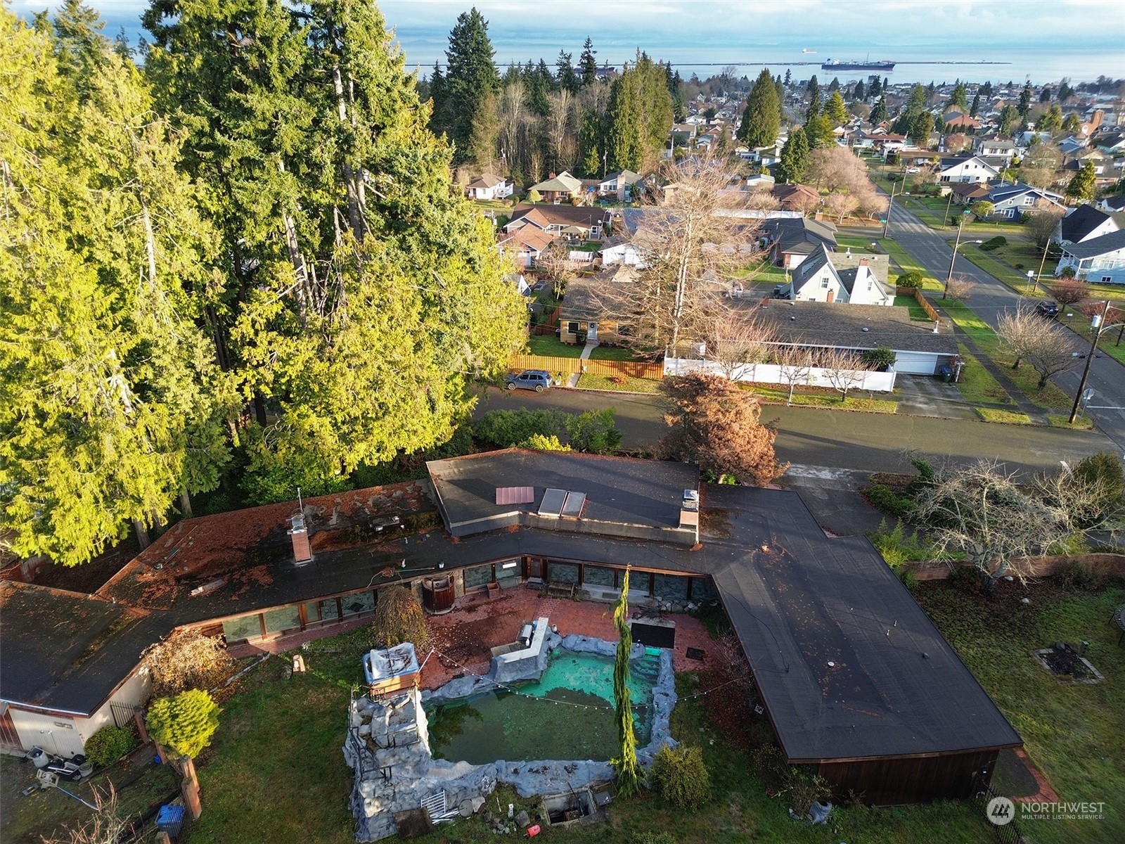 an aerial view of residential houses with outdoor space