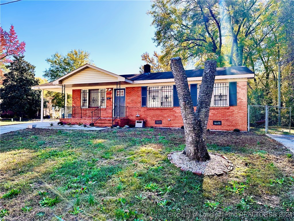 front view of a house with a yard