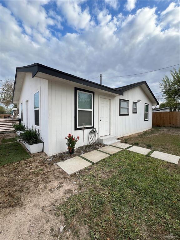 Single story home featuring a front yard