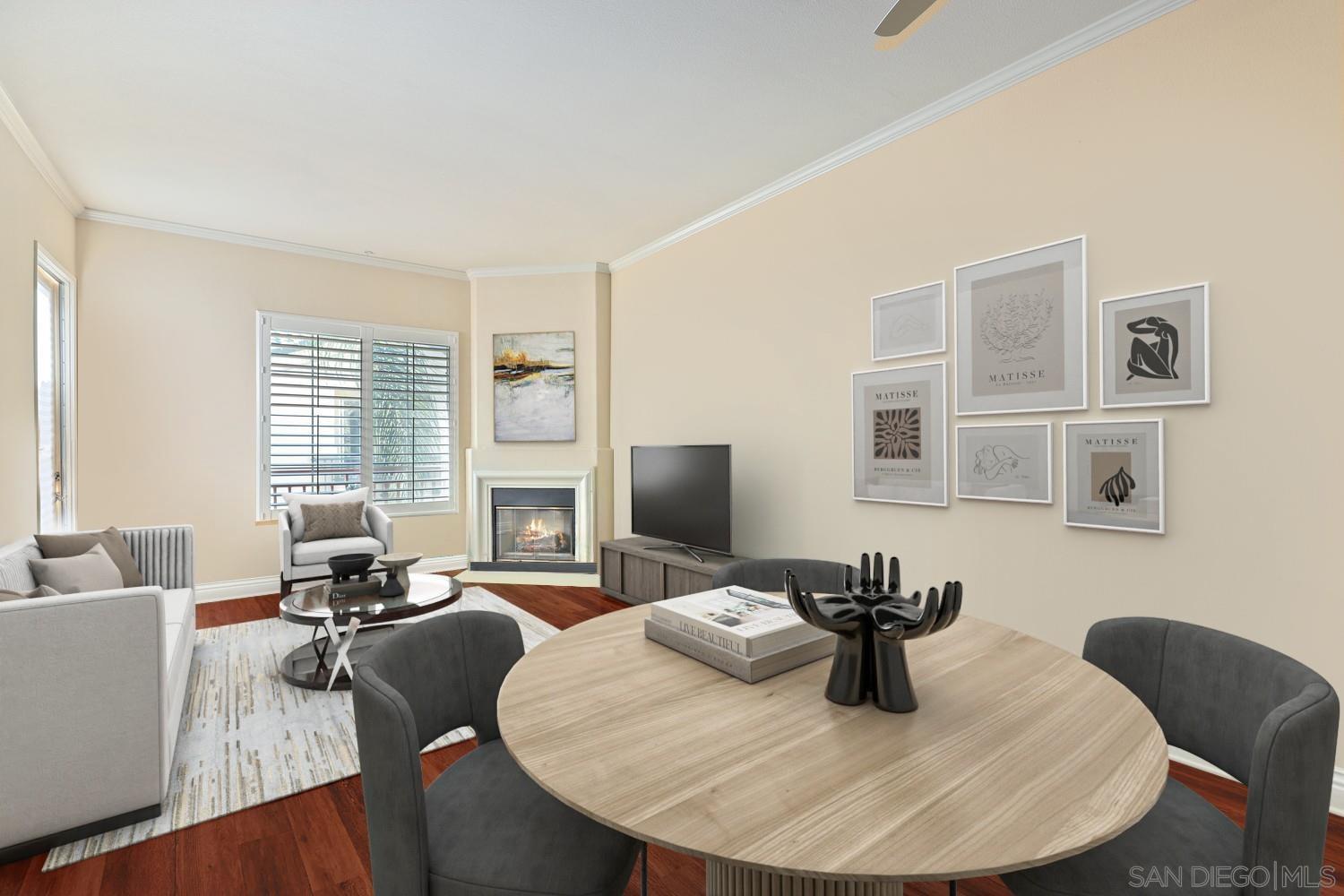 a dining room with furniture and wooden floor