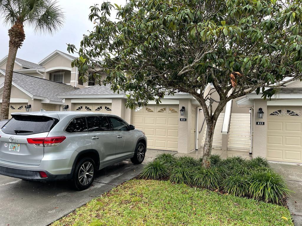 a view of a car in front of a house