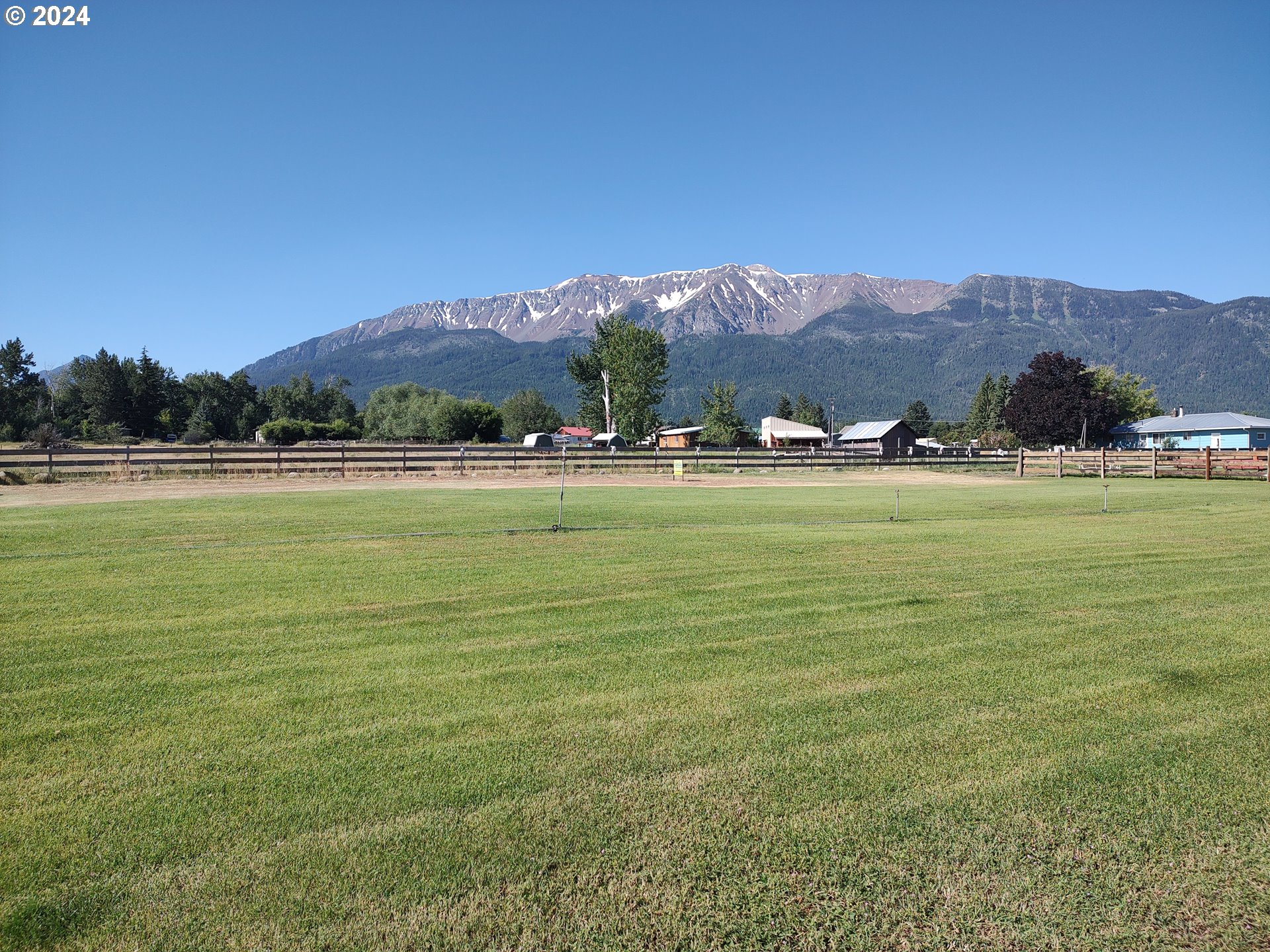 a view of an ocean and mountains in the background